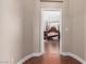 Doorway view of a bedroom with a wooden post bed at 9641 Cripple Gulch Ct, Las Vegas, NV 89178