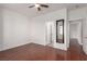 Bright bedroom with hardwood floors and ceiling fan at 9641 S Cripple Gulch Ct, Las Vegas, NV 89178