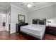 Bedroom with ceiling fan, wood floors, and dresser at 9641 Cripple Gulch Ct, Las Vegas, NV 89178