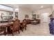 Formal dining room with ornate wood table and chairs at 9641 S Cripple Gulch Ct, Las Vegas, NV 89178