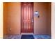 Solid wood door with decorative tile accents at 9641 Cripple Gulch Ct, Las Vegas, NV 89178