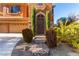 Elegant entryway with iron gate and tiled steps at 9641 Cripple Gulch Ct, Las Vegas, NV 89178