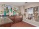 Wet bar with granite countertops and dark wood cabinets at 9641 S Cripple Gulch Ct, Las Vegas, NV 89178