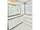 Bathroom with double vanity, soaking tub, and shower at 9701 Ann Arbor Ln, Las Vegas, NV 89134