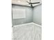 Well-lit bedroom with wood-look floors and window blinds at 9701 Ann Arbor Ln, Las Vegas, NV 89134