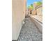 Side yard view showing the home's exterior and landscaping at 9701 Ann Arbor Ln, Las Vegas, NV 89134