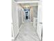 Upper hallway with light grey walls and wood-look floors at 9701 Ann Arbor Ln, Las Vegas, NV 89134