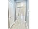Bright hallway with gray walls and gray tile floor at 9701 Ann Arbor Ln, Las Vegas, NV 89134