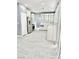 Modern kitchen features stainless steel appliances and gray tile flooring at 9701 Ann Arbor Ln, Las Vegas, NV 89134