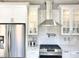 Modern kitchen with stainless steel appliances and white cabinets at 9701 Ann Arbor Ln, Las Vegas, NV 89134