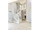 Elegant curved staircase with white railings at 9701 Ann Arbor Ln, Las Vegas, NV 89134