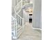 Elegant curved staircase with white railings at 9701 Ann Arbor Ln, Las Vegas, NV 89134