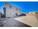 Spacious backyard with gravel and home view at 10306 Coastline Creek Ct, Las Vegas, NV 89141