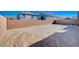 Large backyard with gravel and block wall at 10306 Coastline Creek Ct, Las Vegas, NV 89141