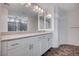 Elegant bathroom with double vanity, large mirror, and tiled floor at 10306 Coastline Creek Ct, Las Vegas, NV 89141