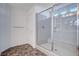 Modern bathroom with a large glass shower and built-in bench at 10306 Coastline Creek Ct, Las Vegas, NV 89141