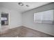 Bright bedroom with window, closet and neutral decor at 10306 Coastline Creek Ct, Las Vegas, NV 89141