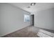 Simple bedroom with window, closet and neutral decor at 10306 Coastline Creek Ct, Las Vegas, NV 89141