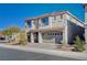 Two-story house with a two-car garage and desert landscaping at 10306 Coastline Creek Ct, Las Vegas, NV 89141