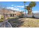 Large backyard with grassy area and a view of the house at 11017 Ladyburn Ct, Las Vegas, NV 89141