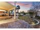 Landscaped backyard with patio and covered seating at 11017 Ladyburn Ct, Las Vegas, NV 89141