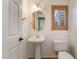 Clean bathroom with pedestal sink and wood shutters at 11017 Ladyburn Ct, Las Vegas, NV 89141