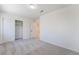 Well-lit bedroom featuring a double door closet and grey carpet at 11017 Ladyburn Ct, Las Vegas, NV 89141