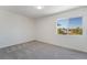 Well-lit bedroom with window and gray carpet at 11017 Ladyburn Ct, Las Vegas, NV 89141