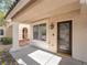 Front porch with a brown door and white columns at 11017 Ladyburn Ct, Las Vegas, NV 89141