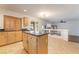 Kitchen with island and view into adjacent living area at 11017 Ladyburn Ct, Las Vegas, NV 89141