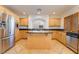 Kitchen with island, stainless steel appliances, and tile floor at 11017 Ladyburn Ct, Las Vegas, NV 89141