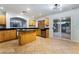 Modern kitchen with light wood cabinets and island at 11017 Ladyburn Ct, Las Vegas, NV 89141