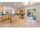 Kitchen with light wood cabinets and a kitchen island at 11017 Ladyburn Ct, Las Vegas, NV 89141