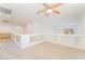 Spacious loft area with a ceiling fan and window at 11017 Ladyburn Ct, Las Vegas, NV 89141