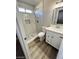 Bathroom with white vanity, marble tile, and shower at 124 Winley Chase Ave, North Las Vegas, NV 89032