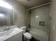 Renovated bathroom, featuring a bathtub and marble tile at 124 Winley Chase Ave, North Las Vegas, NV 89032