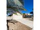 Front view of a house with a driveway and palm trees at 124 Winley Chase Ave, North Las Vegas, NV 89032