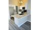 Kitchen island with white cabinets and quartz countertop at 124 Winley Chase Ave, North Las Vegas, NV 89032