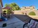 Landscaped backyard featuring patio furniture and fountain at 1260 Corista Dr, Henderson, NV 89052