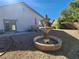 Peaceful backyard with fountain and patio dining area at 1260 Corista Dr, Henderson, NV 89052