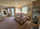 Bright dining room with table and chairs, and liquor cabinet at 1260 Corista Dr, Henderson, NV 89052