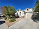 Single-story home with attached garage and desert landscaping at 1260 Corista Dr, Henderson, NV 89052