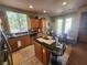 Eat-in kitchen with island, wood cabinets, and stainless steel appliances at 1260 Corista Dr, Henderson, NV 89052