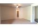 Open living room with neutral carpeting and ceiling fan at 1260 Corista Dr, Henderson, NV 89052