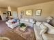 Living room featuring white sofas, coffee table, and decorative lamps at 1260 Corista Dr, Henderson, NV 89052