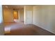 Bright living room with neutral carpeting and access to other rooms at 1260 Corista Dr, Henderson, NV 89052