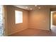 Simple living room with neutral walls and a window with blinds at 1260 Corista Dr, Henderson, NV 89052