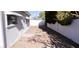 Backyard with gravel and partial fence at 1429 Daybreak Dr, Las Vegas, NV 89108