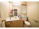 Small bathroom with a toilet, sink, and vanity at 1429 Daybreak Dr, Las Vegas, NV 89108