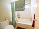 Bathroom with tub shower, tile floor, and updated fixtures at 1429 Daybreak Dr, Las Vegas, NV 89108